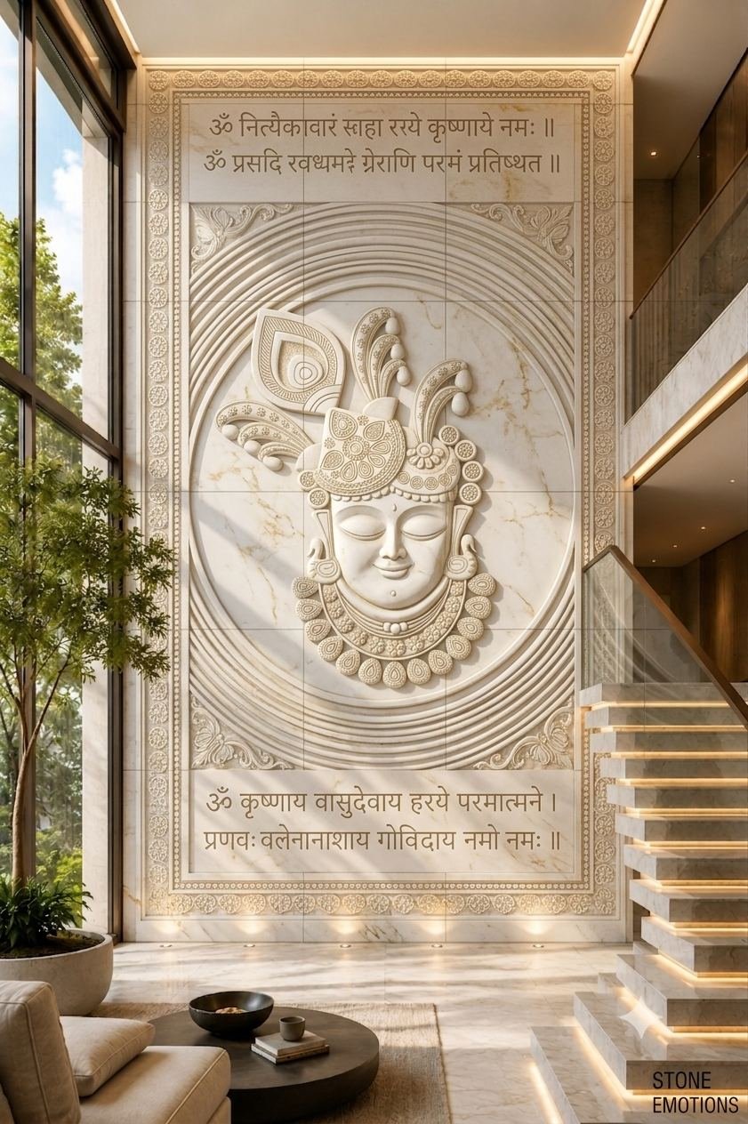 CNC-carved marble mural of Krishna with floral cherry blossom canopy and golden cow reliefs, double-height staircase wall